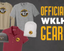 Promotional clothing and hat displaying WKLH Classic Rock 96.5 logos with bold 'OFFICIAL WKLH GEAR!' text on a dark background