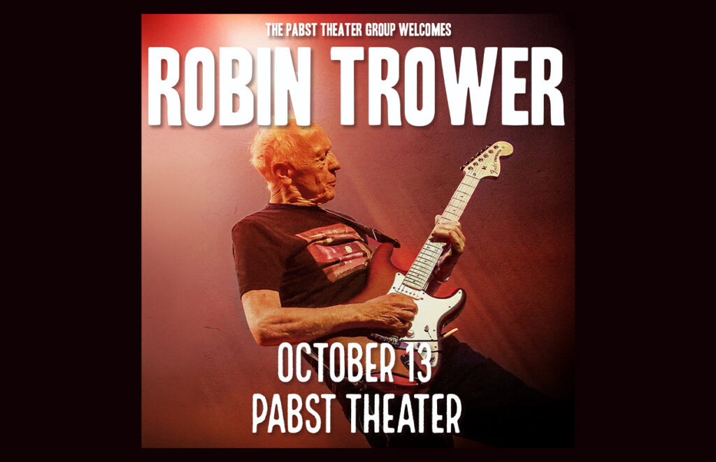 Poster promoting Robin Trower concert: guitarist on stage with white Stratocaster, bold white text 'ROBIN TROWER' and 'OCTOBER 13 PABST THEATER'