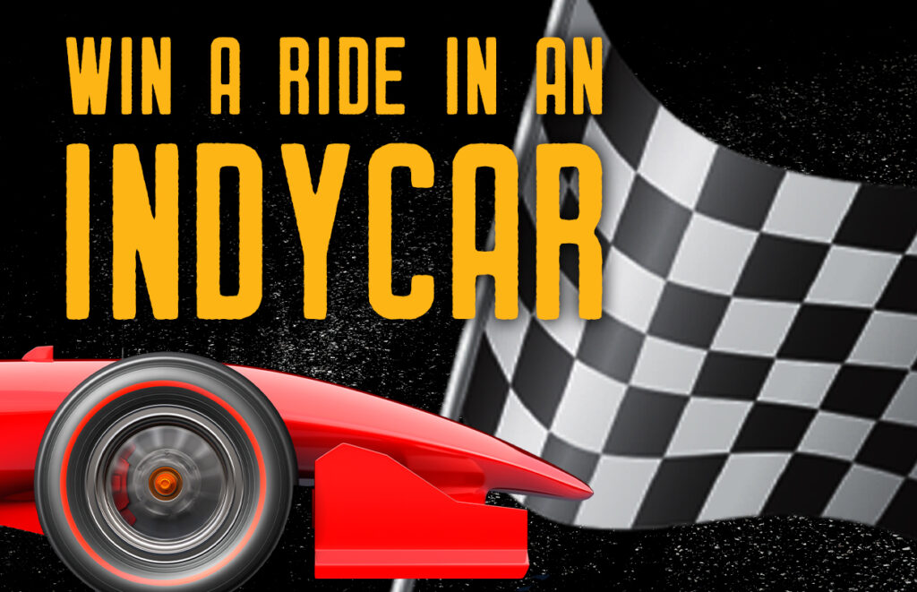 Promotional banner offering a chance to win a ride in an IndyCar, with a red race car and checkered flag in the background